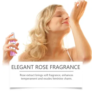 Caucasian woman enjoying the elegant rose fragrance of this roll-on perfume oil.