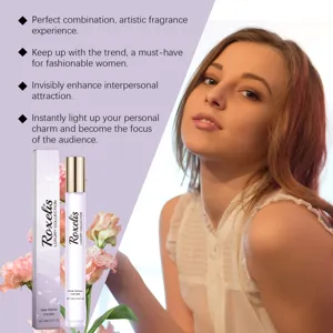 Close-up detail of Roxelis 15ml roller perfume for women with elegant pink carnations