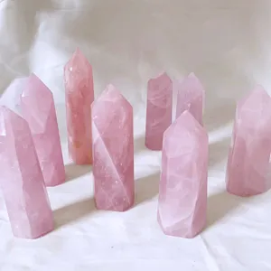 Detailed macro view of premium polished natural rose quartz hexagonal crystal pillars