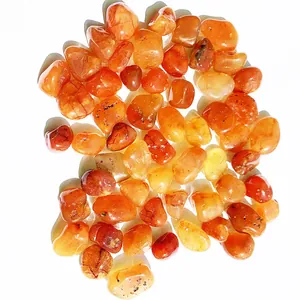 Detailed view of polished natural red carnelian agate tumbled stones for decoration