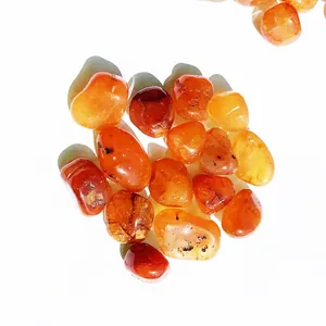 Close-up macro shot of polished natural red agate carnelian tumbled stones