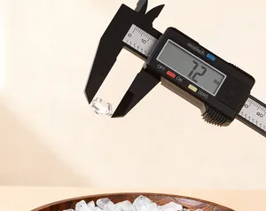 Close-up of a digital caliper measuring a 7.2mm natural white crystal chip