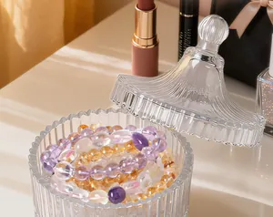 Close-up of crystal purification bowl with amethyst and citrine bracelets in lifestyle setting.