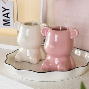 Cute pink and white ceramic bear-shaped aromatherapy soy wax candles in a decorative tray