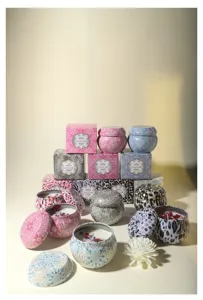 Macro view of patterned tin soy wax candles with dried flower petals