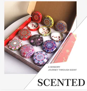 Detailed view of scented soy candle gift set in decorative mandala pattern tins