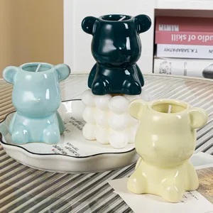 Detailed macro view of colorful cute ceramic bear-shaped soy wax aromatherapy candles