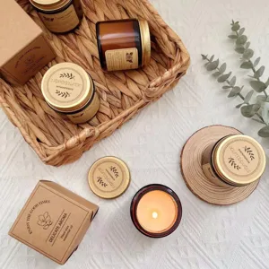 Detail view of 35g soy wax scented candles in amber glass jars with gift boxes.