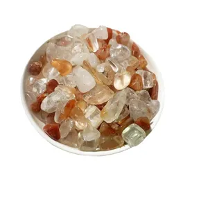 Mixed natural crystal tumbled stones in a white bowl for home and aquarium decor.