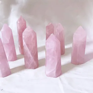 Close-up detail of polished rose quartz hexagonal columns with natural crystal textures