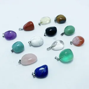 Group of various polished crystal tumbled stone pendants for DIY jewelry making