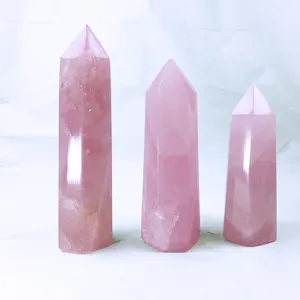 Set of three rose quartz hexagonal crystal pillars in various heights for healing