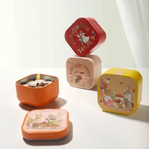 Scented candles in decorative square metal tins featuring cute bunny illustrations