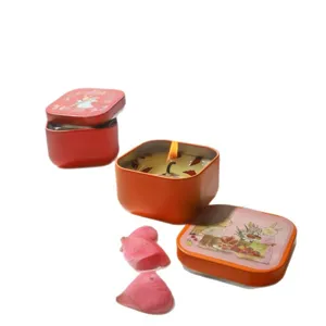 Decorative aromatherapy candles in square metal tins featuring cartoon rabbit lids