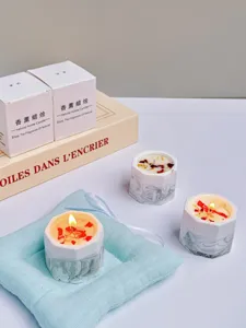 Handmade soy wax scented candles in marble-patterned gypsum cups with floral accents