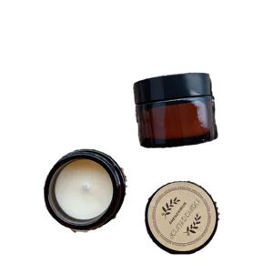 Premium soy wax scented candles in amber glass jars with black lids and labels