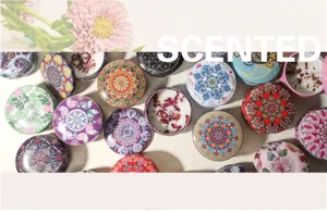 Close-up detail of decorative soy wax scented candles featuring dried flower petals
