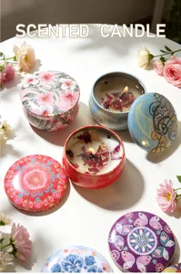 Detailed view of soy wax scented candles in colorful floral tins with dried petals