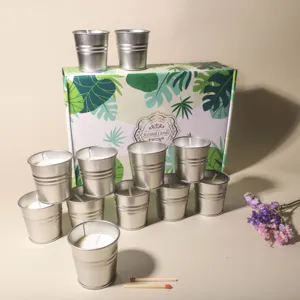 Velas aromáticas de citronela y soja en cubos metálicos con caja de regalo tropical