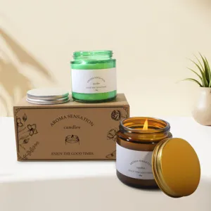 Close-up detail of scented soy wax candles in colored glass jars with kraft box packaging