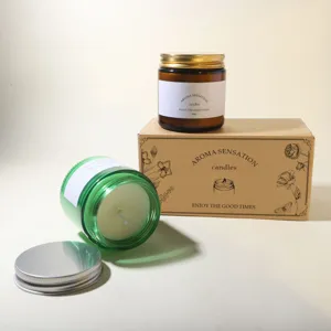 Detailed view of soy wax scented candles in amber and green glass jars with gift box