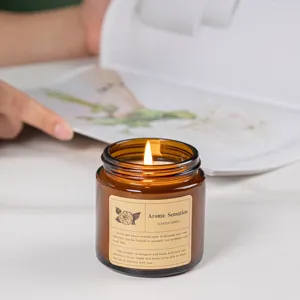 Warm and cozy soy wax scented candle in amber glass jar for aromatherapy and home decor