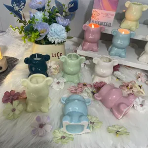 A collection of colorful cute bear-shaped ceramic scented soy wax candles for gifts and home decor
