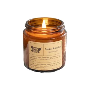 Scented soy wax candle in an amber glass jar with a warm burning flame and floral label