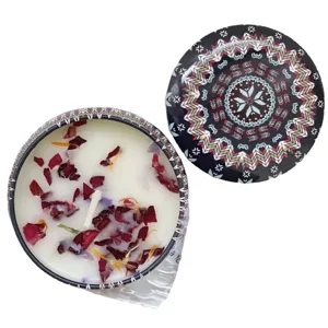 Handmade soy wax scented candle with dried flowers in ethnic mandala pattern tin