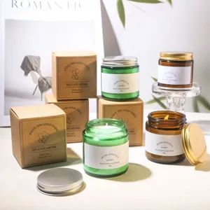 Assorted scented soy wax candles in green and amber glass jars with metal lids and packaging boxes