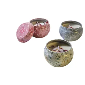 Scented soy wax candles with dried flowers in decorative mandala tin containers