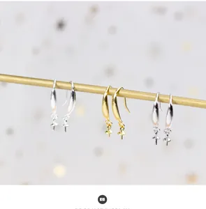 Detailed macro view of S925 silver pearl earring hooks in gold and silver finishes