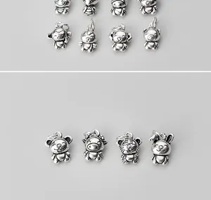 Detailed macro view of vintage S925 sterling silver Chinese Zodiac animal charms for DIY