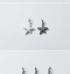 Vue détaillée des pendentifs étoile de mer en argent S925 mat, argent et noir.