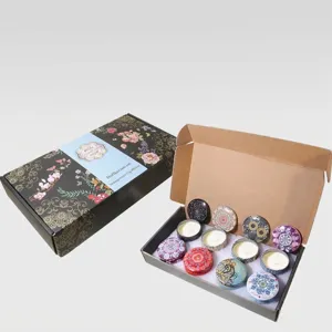 Set de regalo de 8 velas aromáticas en latas florales con aceites esenciales