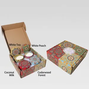 Vista detallada del set de regalo de 4 velas aromáticas con latas decorativas de mandala