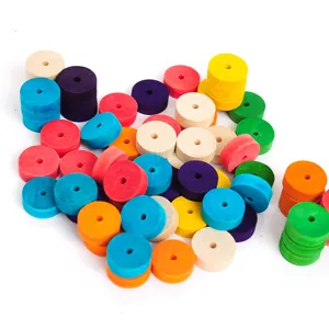 Close-up detail showing colorful DIY wooden wheels and discs for toy car making