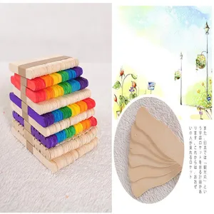 Detailed view of colorful and natural curved wooden craft sticks for DIY projects