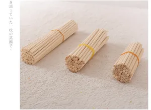 Various sizes of natural round wooden craft sticks bundled for DIY model making projects