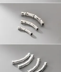 Detailed view of antique matte S999 silver bamboo curved beads for DIY jewelry making.