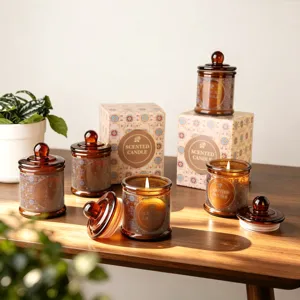 Candele profumate eleganti in vetro ambrato con coperchi e scatole regalo