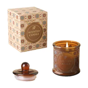 Candela profumata in vetro ambrato con coperchio e confezione regalo fiorita decorata