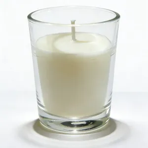 Ivory white unscented candle in a classic clear glass cup for romantic weddings