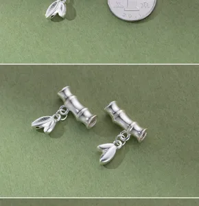 Primo piano di ciondoli in argento S999 a forma di bambù con foglie per gioielli DIY