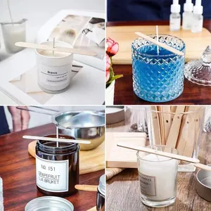 Detailed close-up showing wooden wick holders stabilizing wicks in various candle jars