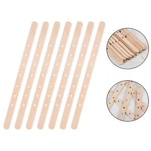 Detailed view of wooden candle wick centering sticks with multi-hole design for DIY crafts.
