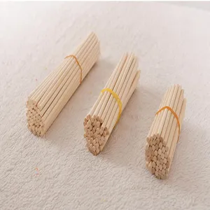 Three bundles of natural wooden craft sticks in various lengths for DIY arts and craft projects