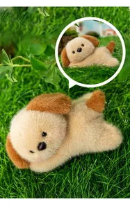 Detailed macro view of a cute plush puppy toy laying on green grass