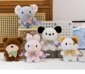 Group of cute plush animal keychains including rabbit, bear, and cat dolls for backpacks.