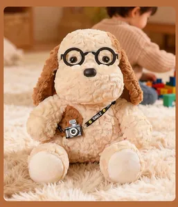 Adorable plush dog toy wearing black glasses and camera accessory on a soft white rug